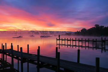 Fototapeta na wymiar enjoy a magical sunrise at lake Ammersee Bavaria