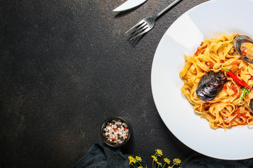 pasta with mussels (tagliatelle seafood) menu concept. food background. copy space. Top view