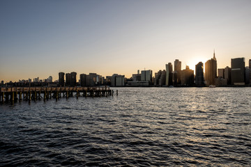 Long Island City Gantry sign and Manhattan midtwon skyline in front of east river