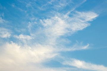 Abstract blurred background Blue sky with white clouds in sunlight.