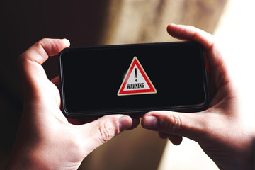 alert symbol design on smart phone screen 