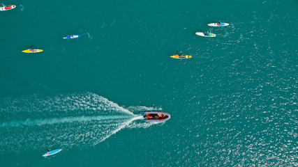 Aerial bird's eye view photo taken by drone of stand up paddle surfers in annual SUP crossing...