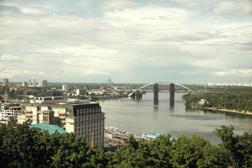 Big city behind, abstract urban landscape with architecture elements and skies