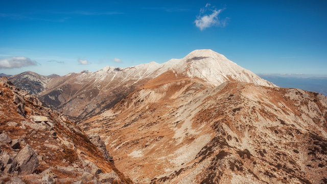 Vihren and Kutelo peaks with the horse traverse in Pirin national park, Bulgaria. Panoramic  view from Muratov peak.