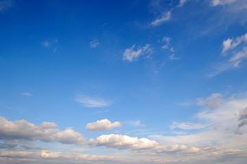 Fluffy clouds in the blue sky.