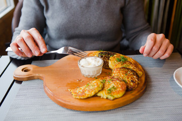 food lunch potato pancakes sour cream