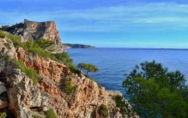 Fototapeta na wymiar Beautiful beach in Spain with steep cliffs.
