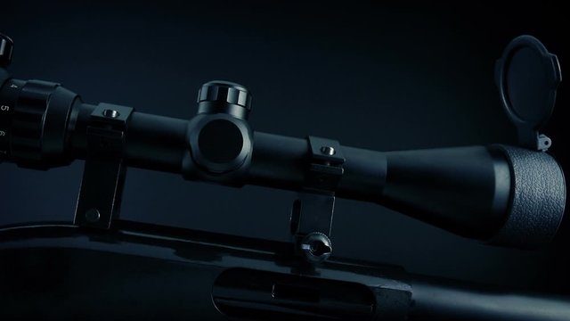 Scope On Rifle In Dark Room