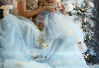 Fototapeta na wymiar mom and baby at Christmas in beautiful outfits