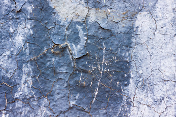 the background of the walls is painted in white and gray with cracks
