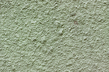 background of part of the wall with granular green paint