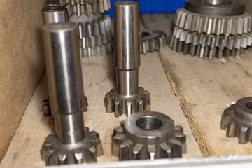 Gear cutting tool in a warehouse in a workshop, a worm cutter for gear processing on a gear cutting machine.