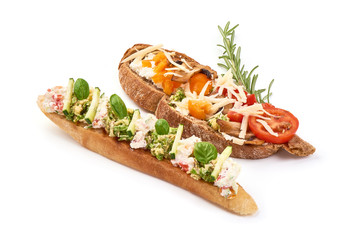 Bruschetta with tomatoes, cottage cheese, cucumber and basil. Spanish Tapas and Pinchos, isolated on white background