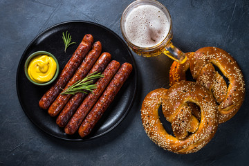 Oktoberfest food - sausage, beer and bretzel.