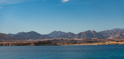 Landscape. Sea and sand mountains.