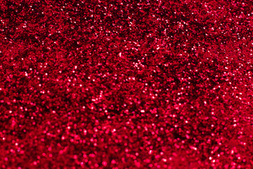 Red glitter texture. Festive sparkling sequins background closeup. Wpaper for Valentine, New Year...