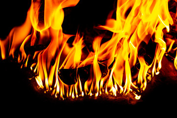 fire and sparks, from a campfire on a dark night background, front and background blurred