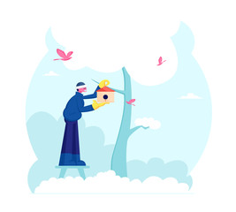 Man Hanging Birdhouse on Tree in Winter or Spring Time