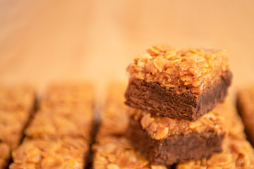 square brownies with caramel and flakes