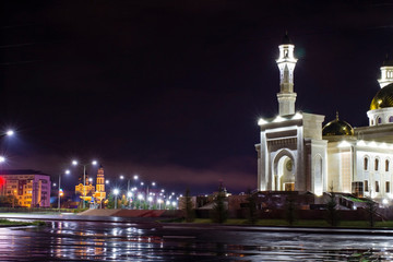 mosque at night after rain in light illumination