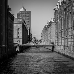 The Old storage house area at the port of Hamburg known as „Speicherstadt“  - obrazy, fototapety, plakaty