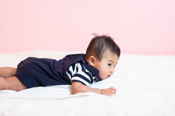 Happy newborn cute baby in studio