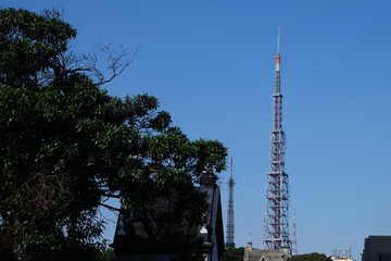 Metal tower or turret telecommunications satellite dishes reception and emission located on the...
