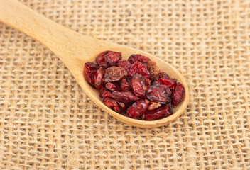 Dry barberry in spoon