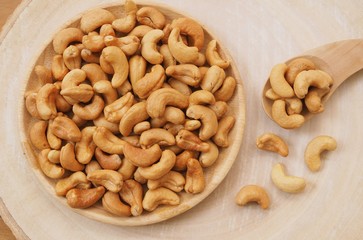 Cashew nuts on a wooden spoon