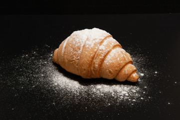 Croissant on a black background