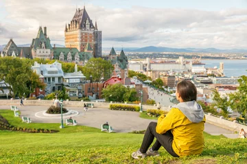 Wall murals Canada Canada travel Quebec city tourist enjoying view of Chateau Frontenac castle and St. Lawrence river in background. Autumn traveling holiday people lifestyle.