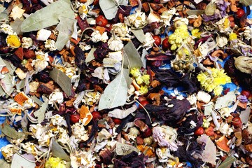 Herbal tea from berries and flowers. Very tasty and healthy brewing drink. Tea on a neutral background in blue.