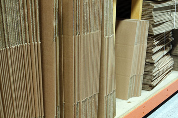 New unused cardboard boxes in small online store warehouse.