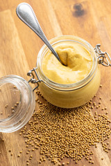 The yellow mustard in jar.