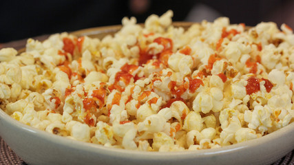 Popcorn served with pepper sauce in a bowl