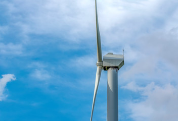 Wind turbines with power line in the sunset 