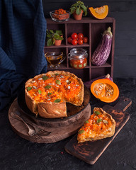 Pumpkin rustic tart on dark background on wooden table.  Thanksgiving day.