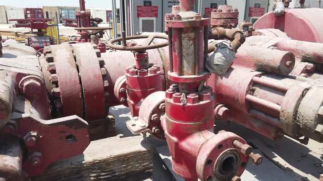 Old Blow Out Preventer (BOP) laying on the shipyard in the desert