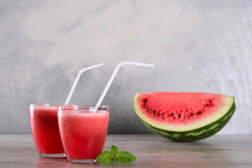  Watermelon smoothie on wood background , healthy drink. Summer. Watermelon pieces. Blender