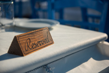 Reserved sign on a restaurant table in greece