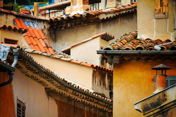 many crooked and crossed roofs in Grasse in provence, France