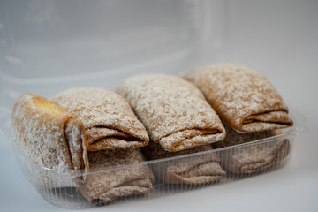 Delicious pastries are in plastic packaging.