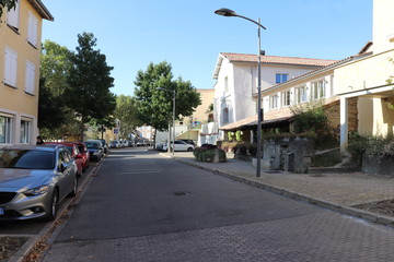 Fototapeta na wymiar Rue Centrale dans le village de Communay - Département du Rhône - France