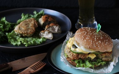 Brain Burger. Fried brains beef, calf or sheep are fried in deep fried as a cutlet in a burger. lettuce, cheese sauce, fresh cucumber and capers. fashionable exotic food. weird food