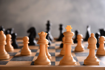 board game for ideas and strategy, business success concept. hand of businessman man moving chess figure in competition success play.  strategy, management or leadership concept.playing photographed 