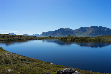Fototapeta na wymiar Lake near a fishing village Hovsund, Norway