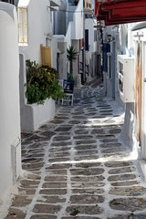 White painted paved back street in Mykonos old town, Greek Islands