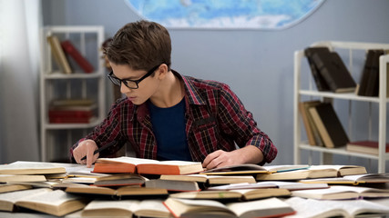 Genius school pupil reading books sitting table, study research, development