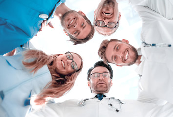 Obraz na płótnie Canvas doctors looking down smiling at the camera
