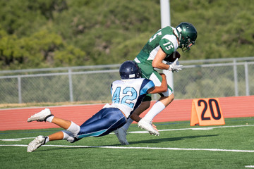 Great action photos of high school football players making amazing plays during a football game